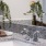 a bathroom with a sink and a plant on the counter