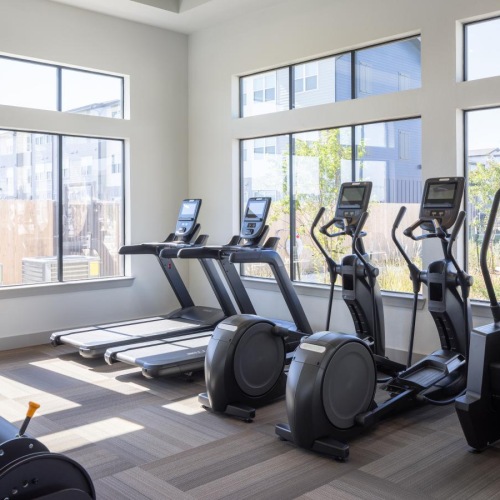 A newly constructed community a room with exercise equipment