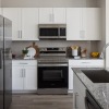 a kitchen with white cabinets