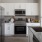 a kitchen with white cabinets
