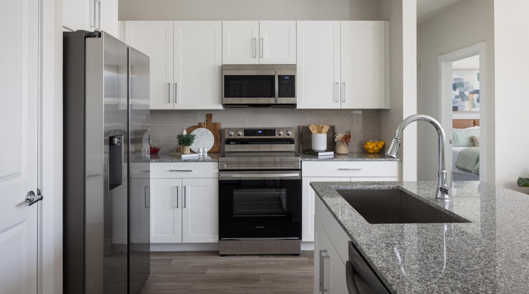 Redefine New Braunfels living a kitchen with white cabinets
