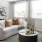 a living room with a white couch and a coffee table